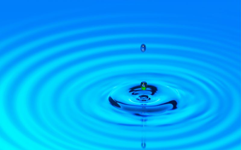 drop of water creating ripples in water