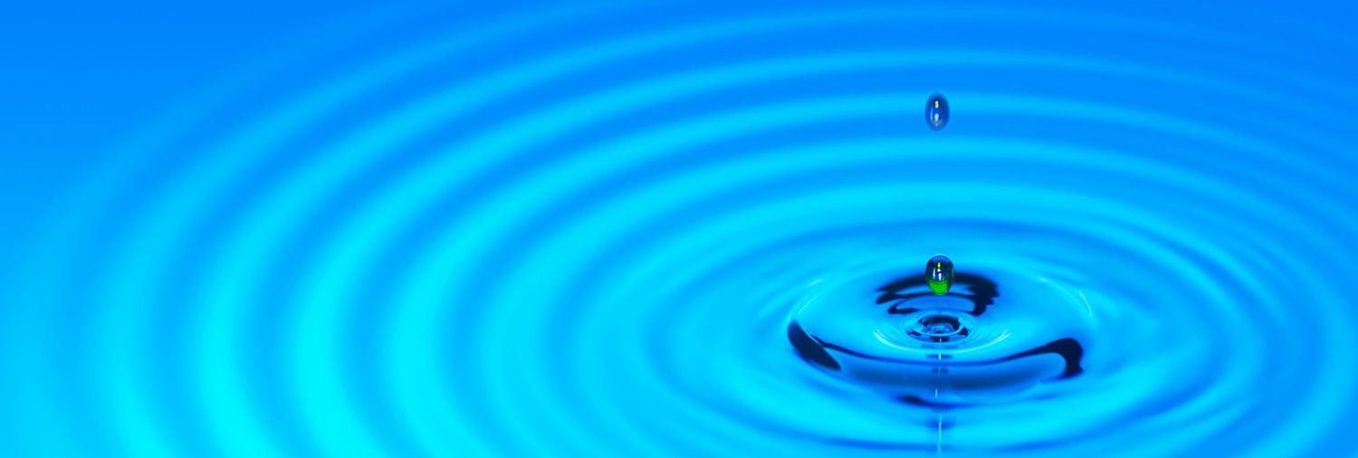 drop of water creating ripples in water