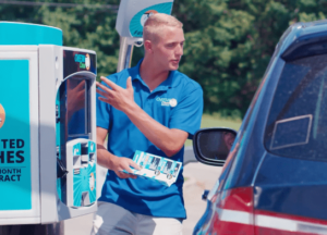 car-wash-attendant-with-customer-at-XPT-300x216.png